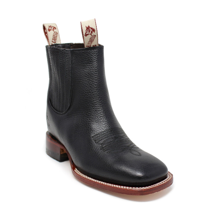 A black squared toe ankle boot with a low heel and leather sole, featuring a visible brand label on the top.