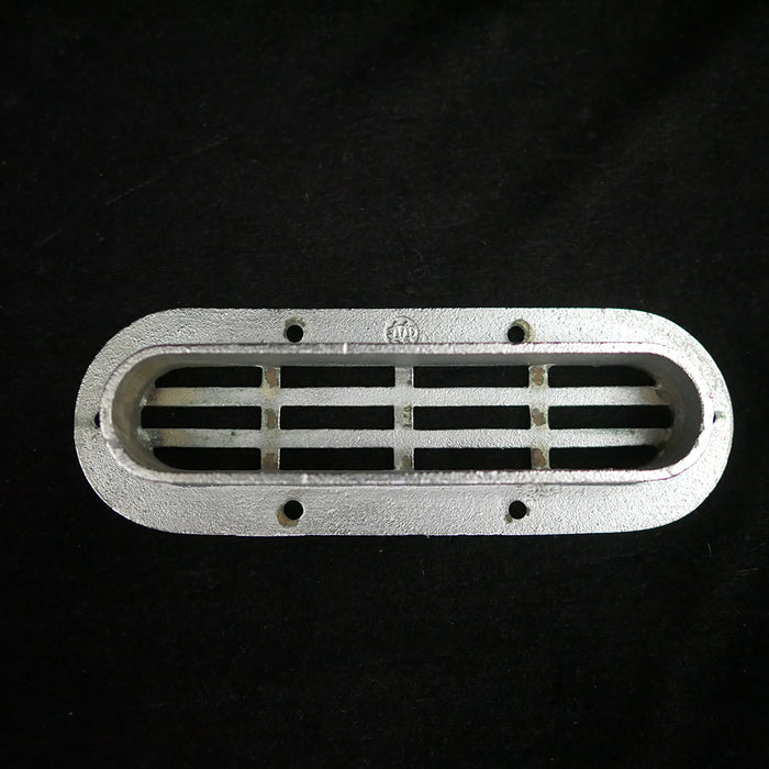 Vintage oval flush stainless steel drain cover.