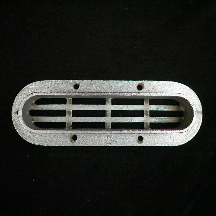Vintage oval flush stainless steel drain cover.