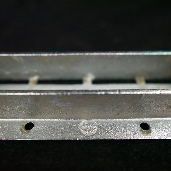 Vintage Wilcox Crittenden oval flush stainless steel drain cover.